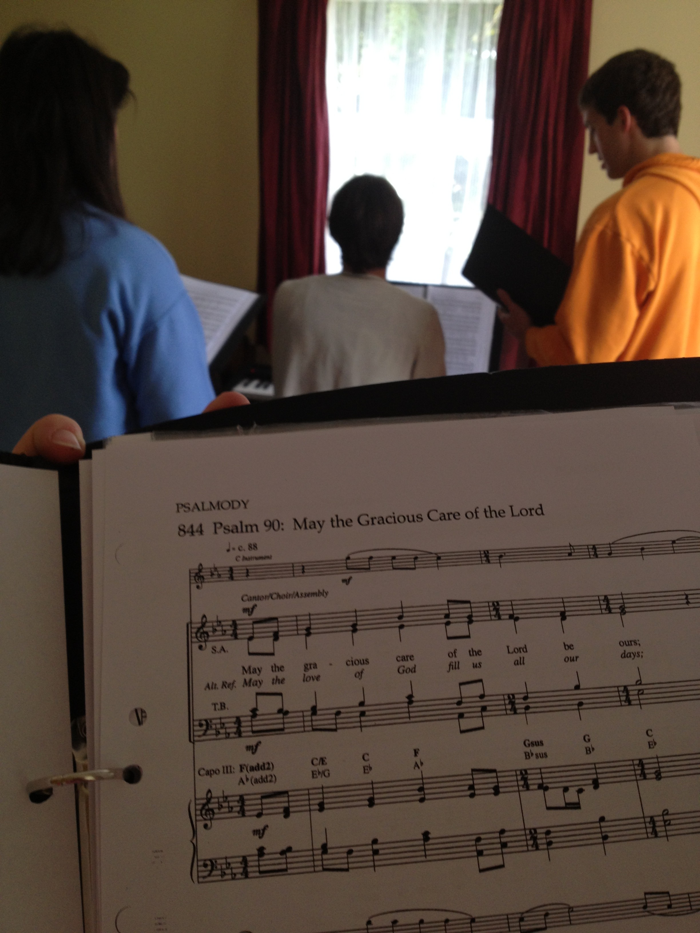 It's really not uncommon for us to gather around the piano and practice music.  (Take a guess who's music we're working on here!)